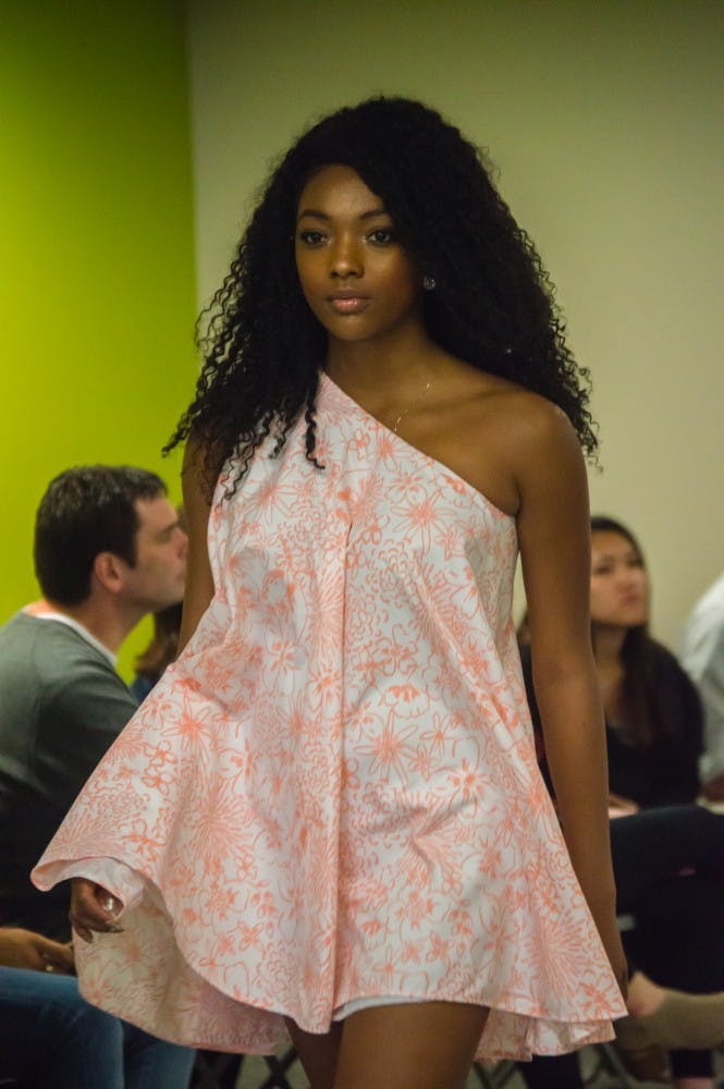 Family and friends watched the Fashion Design Soceity host a fashion show on April 1 in the Applied Technology Building. Since 1997, the organization helps fashion students develop their skills. Teri Lightning Jr., DN