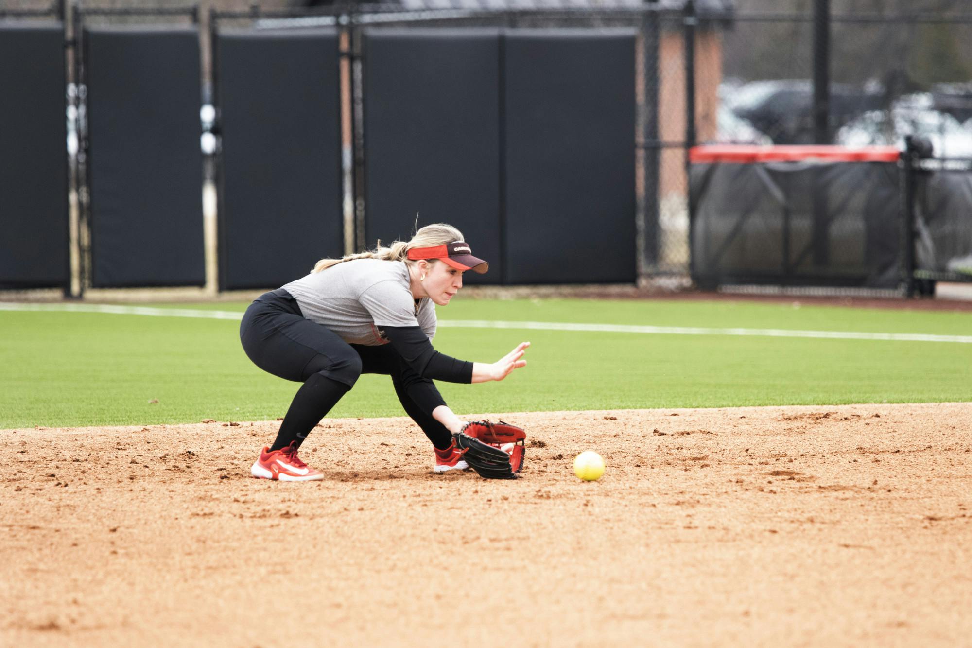 Redshirt freshman infielder McKenna Mulholland gloves a ground ball during a practice Feb. 14 at the Softball Filed at First Merchants Ballpark Complex. Zach Carter, DN