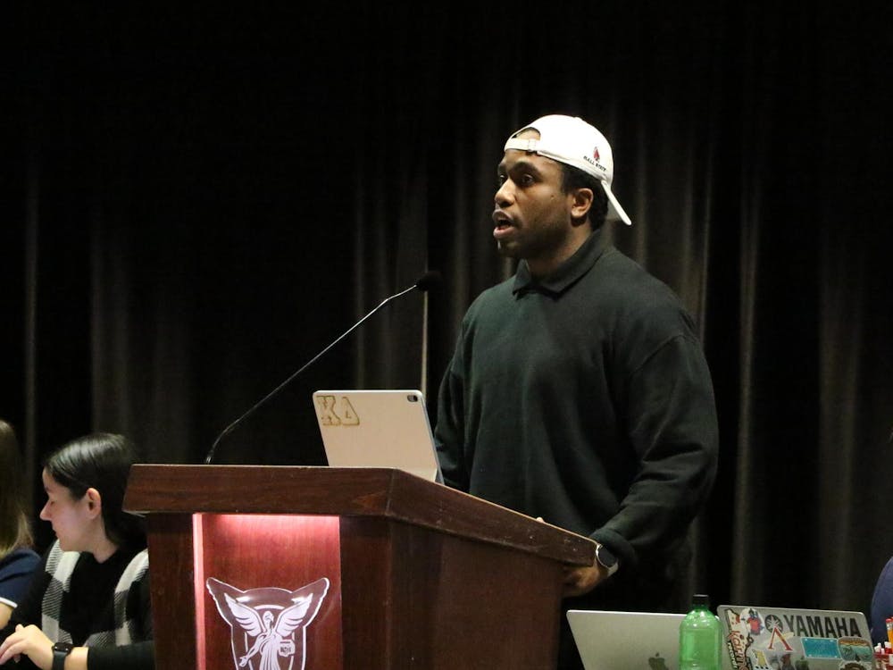 Sinclair Nzenwata giving a presentation to join At-Large
Senate for Student Government Association inside the L.A. Pittenger Student Center Cardinal Hall A Feb 18. Landon Jones. DN.
