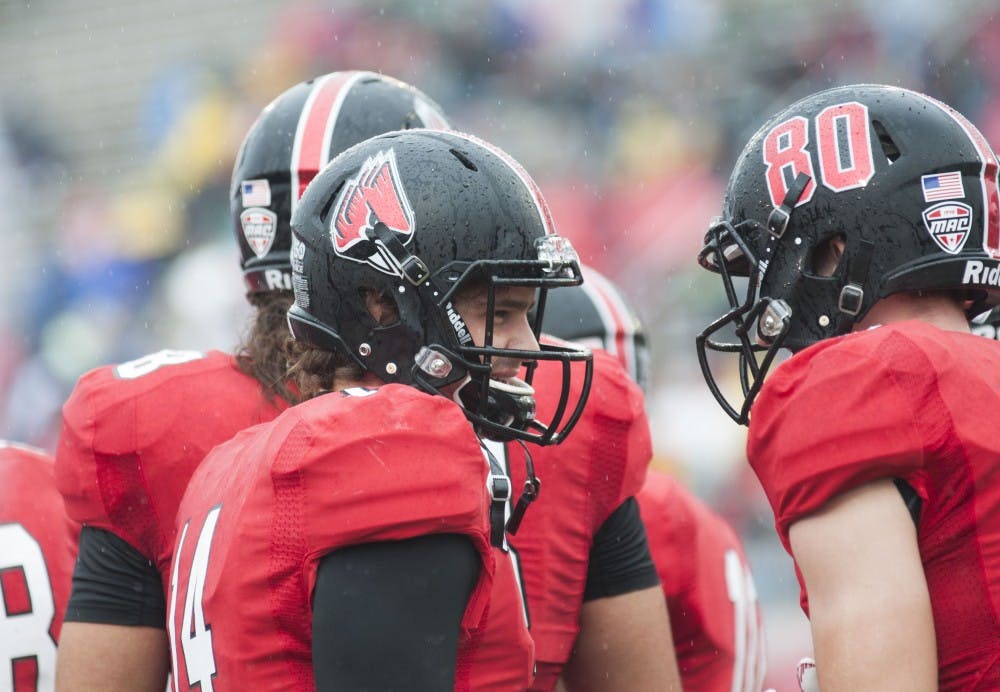 Members of the Ball State football team talk on the sidelines during the game against Central Michigan on Oct. 24 at Scheumann Stadium. DN PHOTO EMMA ROGERS