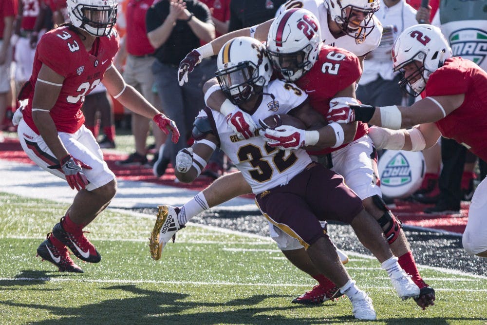 Running back Berkley Edwards is brought down at the 40-yard line by redshirt freshman linebacker Brandon Martin during the first half of Ball State’s homecoming game against Central Michigan, Oct. 21 at Scheumann Stadium. Central Michigan defeated Ball State, 9-56. Grace Hollars, DN