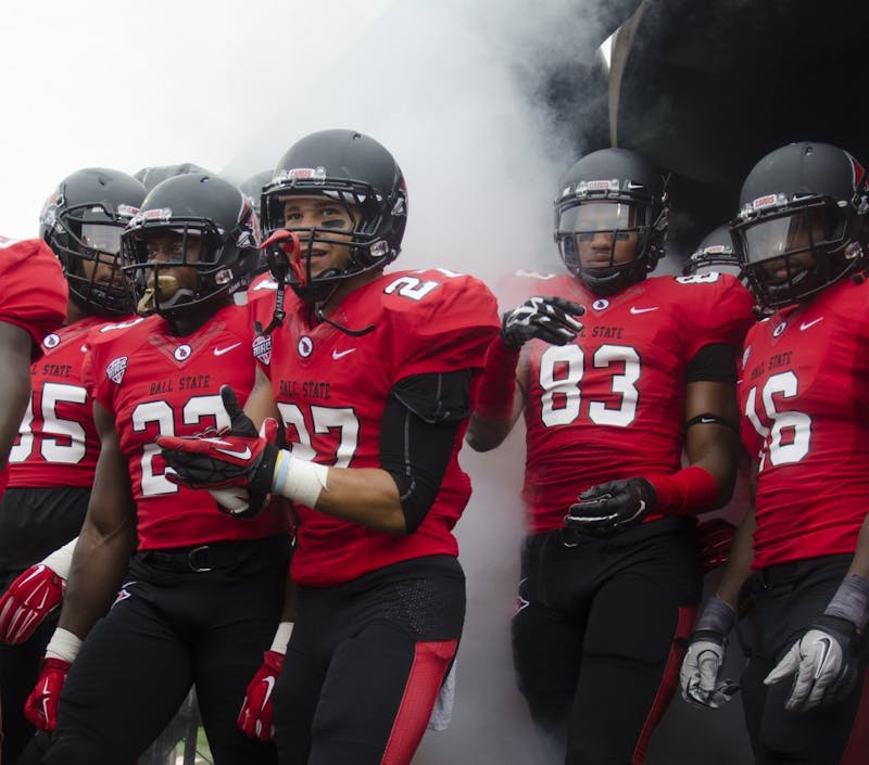 Members of the Ball State football team get ready to take the field before the start of the home opener against Colgate on Aug. 20 at Scheumann Stadium. DN PHOTO BREANNA DAUGHERTY 