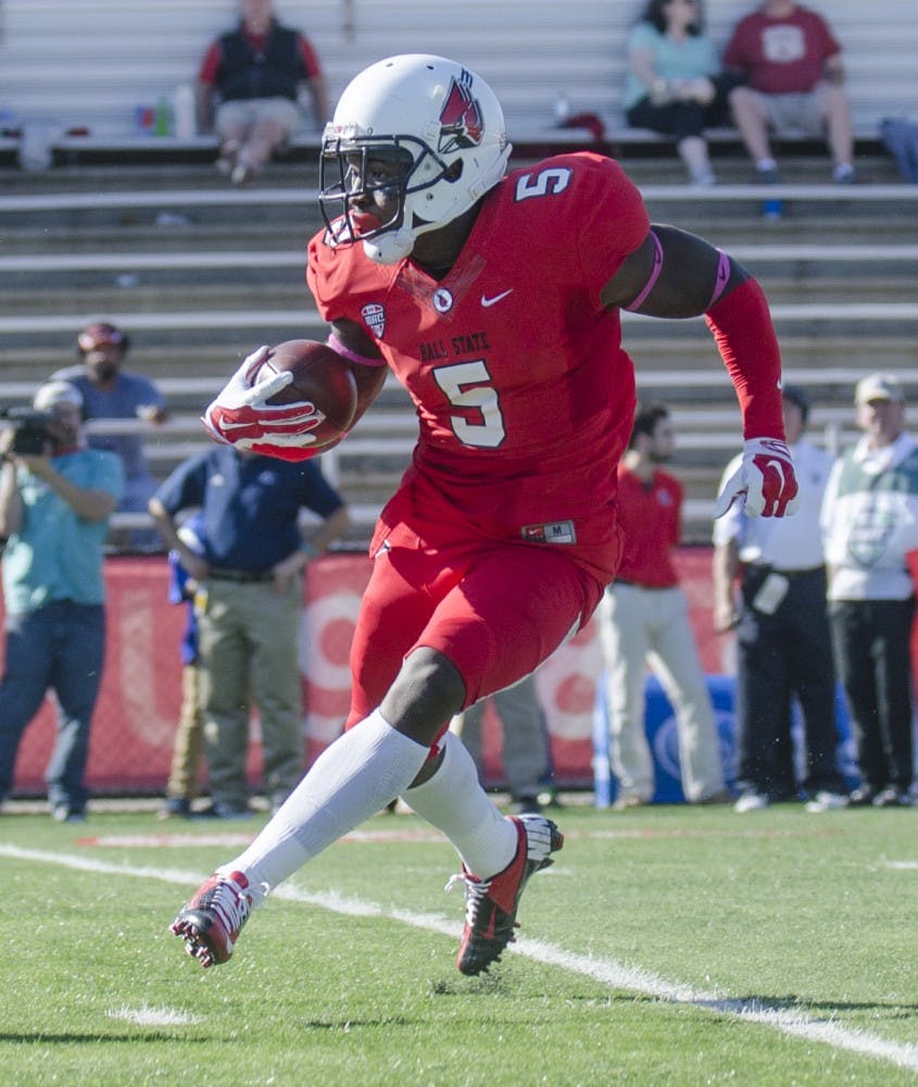Senior cornerback Eric Patterson carries the ball down the field during the game against Akron on Oct. 25 at Scheumann Stadium. DN PHOTO BREANNA DAUGHERTY