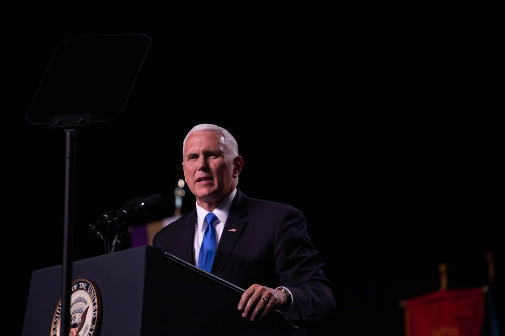 Vice President Mike Pence delivers his speech at Odle Arena on the campus of Taylor University May 18, 2019 during the 2019 commencement. Before Pence began his speech, during a song, some students and faculty walked out. Scott Fleener, DN