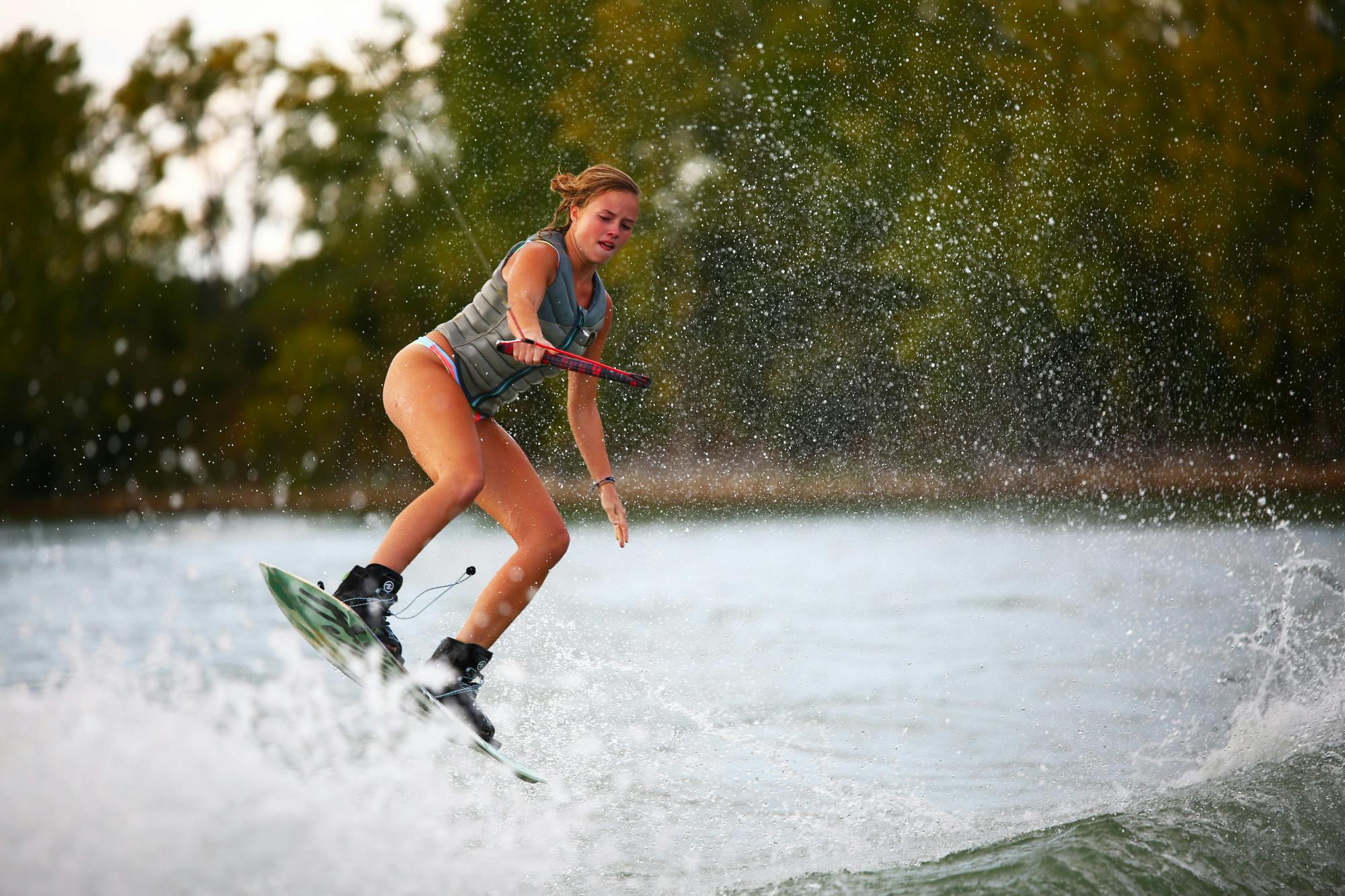 Second-year art education major Coleen Davis jumps a wake Sept. 11 at the Case Family Property in Muncie, Ind. Davis is a water skier for the club but has been learning wakeboarding. Mya Cataline, DN