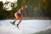 Second-year art education major Coleen Davis jumps a wake Sept. 11 at the Case Family Property in Muncie, Ind. Davis is a water skier for the club but has been learning wakeboarding. Mya Cataline, DN