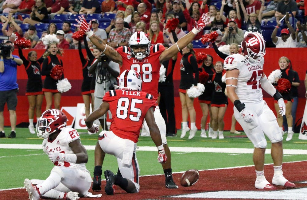 <p>Ball State redshirt junior tight end Nolan Givan and sophomore wide receiver Yo'Heinz Tyler celebrate after Tyler's touchdown during the Cardinals' game against Indiana Aug. 31, 2019, at Lucas Oil Stadium. Tyler had 71 receiving yards. <strong>Paige Grider, DN</strong></p>