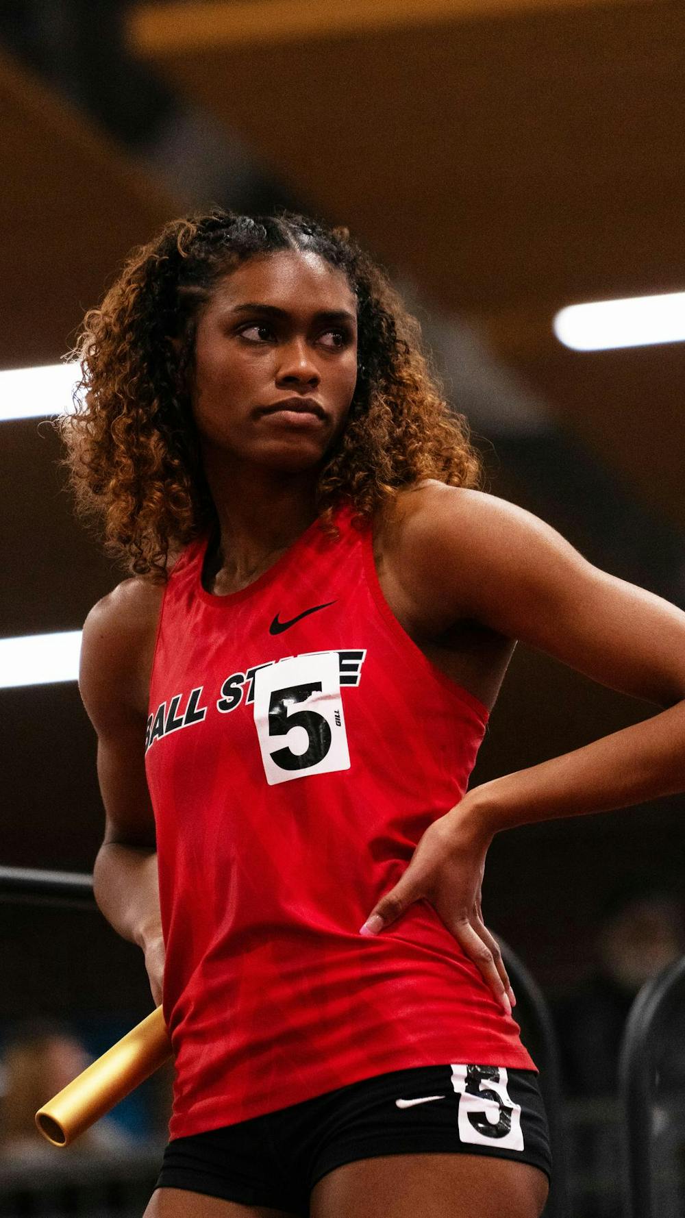 Senior sprinter Alexis Thigpen prepares to run the first leg of the 4x400 relay race at the IUPUI Invitational Jan. 27 at the Indiana State Fairgrounds in Indianapolis. The 4x400 relay race team placed first overall in the invitational. Amadou Diallo, DN