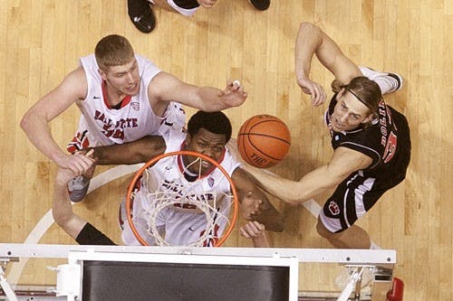 Zach Fields and Bo Calhoun from Ball State fight for the redound against Northern Illinois's Aksel Bolin to catch the rebound. Ball State won the game 53 to 51. DN PHOTO JORDAN HUFFER