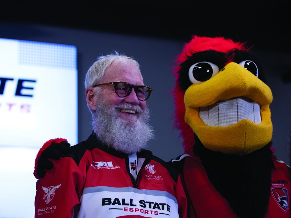 David Letterman poses for a photo with Charlie Cardinal Feb. 9 in the Robert Bell Building at Ball State University. Letterman visited campus to celebrate the Rahal Letterman Lanigan Racing Esports partnership. Eli Houser, DN