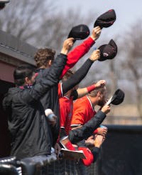 Members of the Ball State baseball team celebrate after a play April 3, 2021, at Ball Diamond at First Merchants Ballpark Complex. The Cardinals won their second game of the day 16-10 against the Bulldogs. Jaden Whiteman, DN