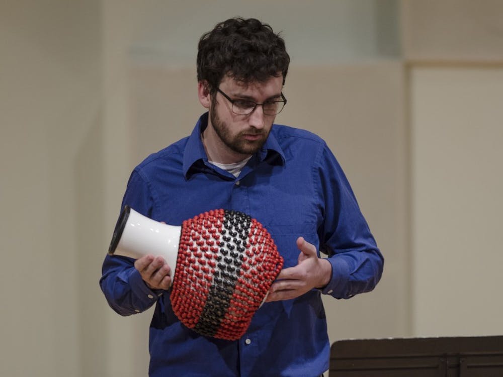 Percussionist Kyle Snyder performs on May 1 with the Brazilian Ensemble at John J. Pruis Hall. The coordinator of the Ensemble was Bruno Carera, who arranged the music. Stephanie Amador // DN