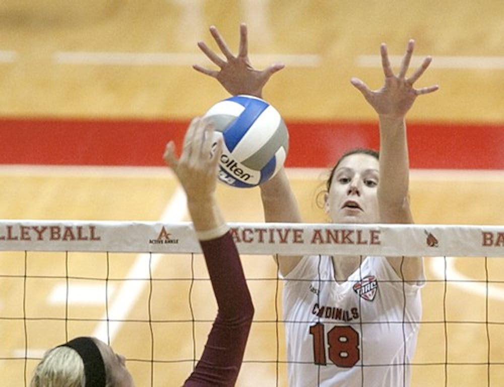 Redshirt sophomore Hayley Benson blocks a ball from entering Ball State territory during a game Sept. 17 in Worthen Arena. On Sept. 28, Ball State defeated Central Michigan University, 3-0. DN FILE PHOTO JORDAN HUFFER
