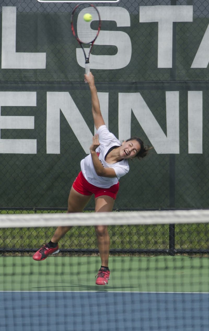 Sophomore Rosalinda Calderon serves the ball during the doubles match against Butler for the Fall Dual on Sept. 20 at the Cardinal Creek Tennis Center. Calderon and her partner senior Courtney Wild won 8-6. DN PHOTO BREANNA DAUGHERTY 