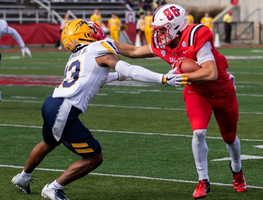 Redshirt Senior Wide Receiver Riley Miller stiff arms Toledo Freshman Cornerback Chris McDonald Oct.19, 2019, at Scheumann Stadium. Miller had 2 touchdowns against Toledo. Jacob Musselman, DN