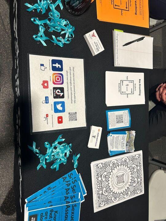 The Ball State Counseling Center table in the Jo Ann Gora Student Recreation and Wellness Center during the “What Were You Wearing” event on Wednesday, April 17. Victims of sexual assault are often asked what they were wearing which is a form of victim blaming. (Maya Kim, DN)