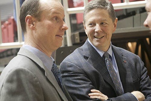 Athletic director Bill Scholl speaks with women’s basketball coach Brady Sallee after a game. Scholl has been tasked with finding replacement head coaches for the gymnastics and softball teams. DN FILE PHOTO JORDAN HUFFER