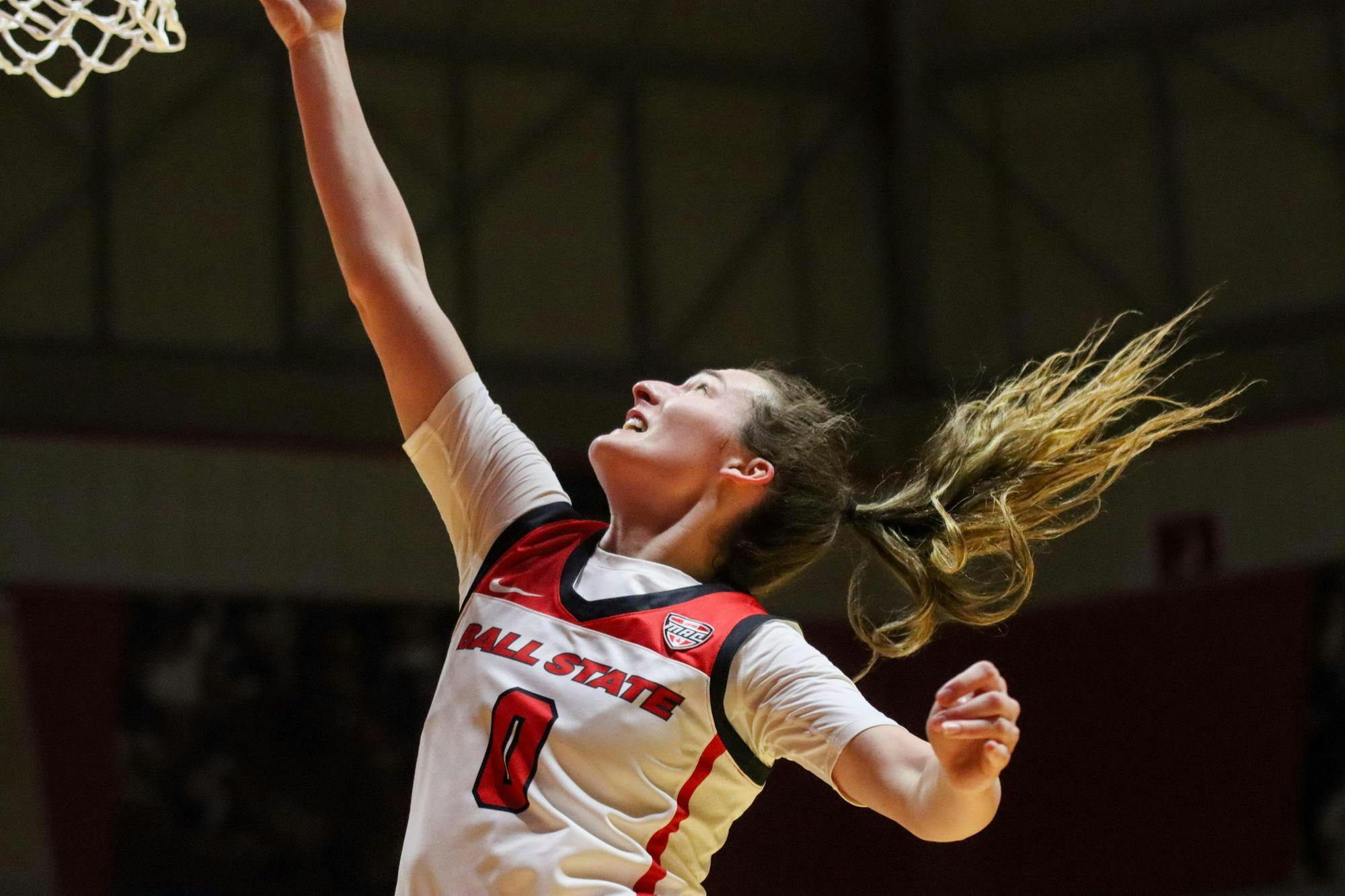 Junior Ally Becki puts the ball in for two-points against Akron Feb. 28 at Worthen Arena. Isaiah Wallace, DN