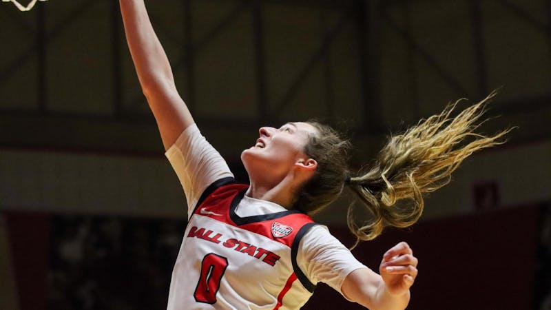 Junior Ally Becki puts the ball in for two-points against Akron Feb. 28 at Worthen Arena. Isaiah Wallace, DN