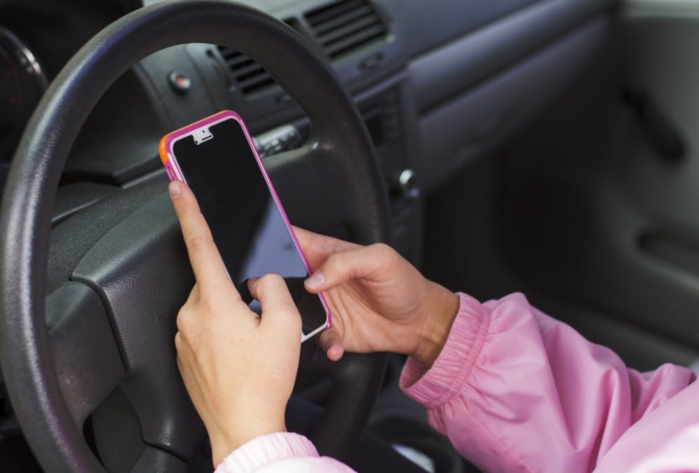 An on-duty Muncie police officer that was&nbsp;caught texting while driving is going viral on Facebook.&nbsp;DN PHOTO SAMANTHA BRAMMER