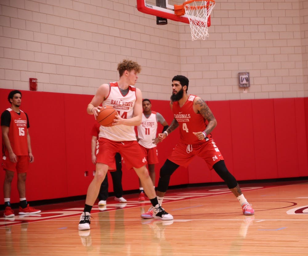 <p>Redshirt senior Trey Moses defends redshirt freshman center Blake Huggins during a practice at Dr. Schondell Practice Center on Nov 29, 2018.<strong> Jack Williams,DN&nbsp;</strong></p>