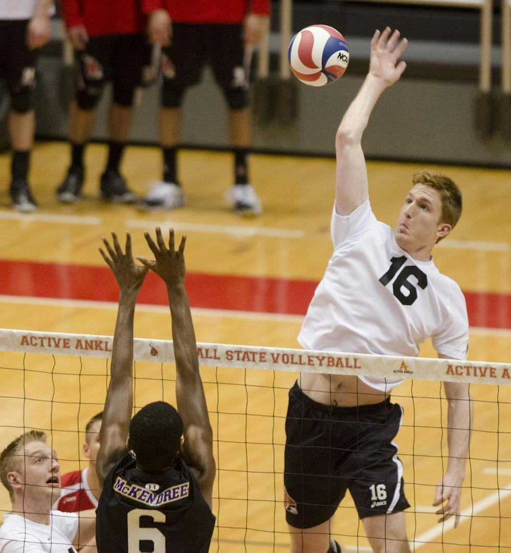 Senior middle attack Kevin Owens jumps to hit the ball to the McKendree side during the first set Jan. 24 at Worthen Arena. DN PHOTO BREANNA DAUGHERTY