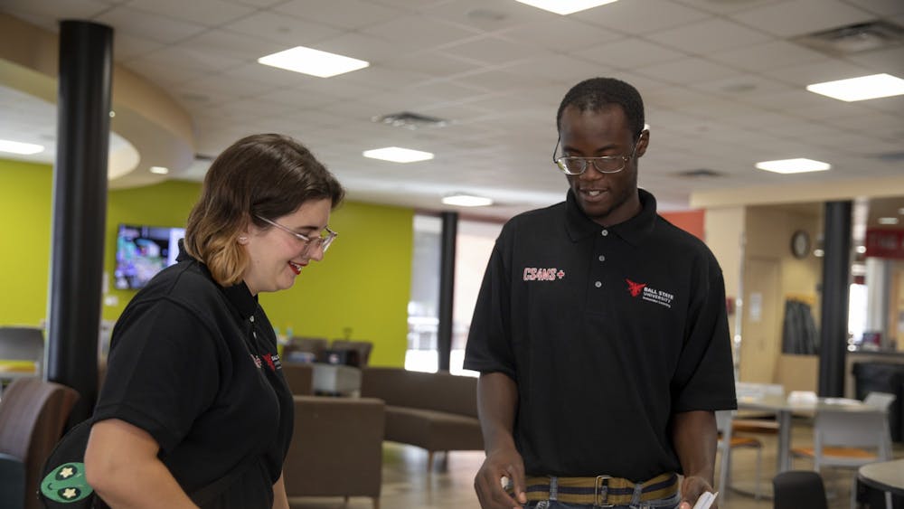 CS4MS+ students Gwyn Hultquist and Brian Walker engage in conversation at a computer science conference in Indianapolis Sept. 16, 2019. CS4MS+ aims to provide students with real-world teaching experience. Robbie Mehling, Photo Provided