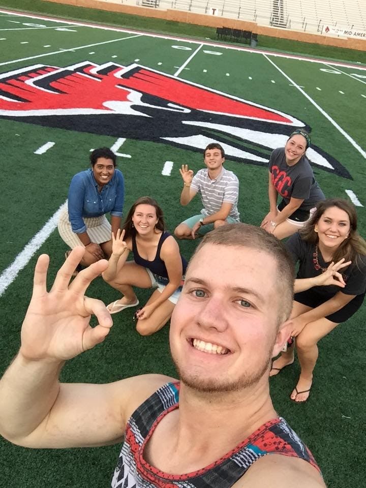 Former SGA Vice President Bryan Kubel and others pose for a photo on Sept. 1 at Scheumann Stadium. The group went out to practice for the Cardinal Project, which is taking place after the football game on Sept. 3 at Scheumann Stadium. PHOTO COURTESY OF FACEBOOK