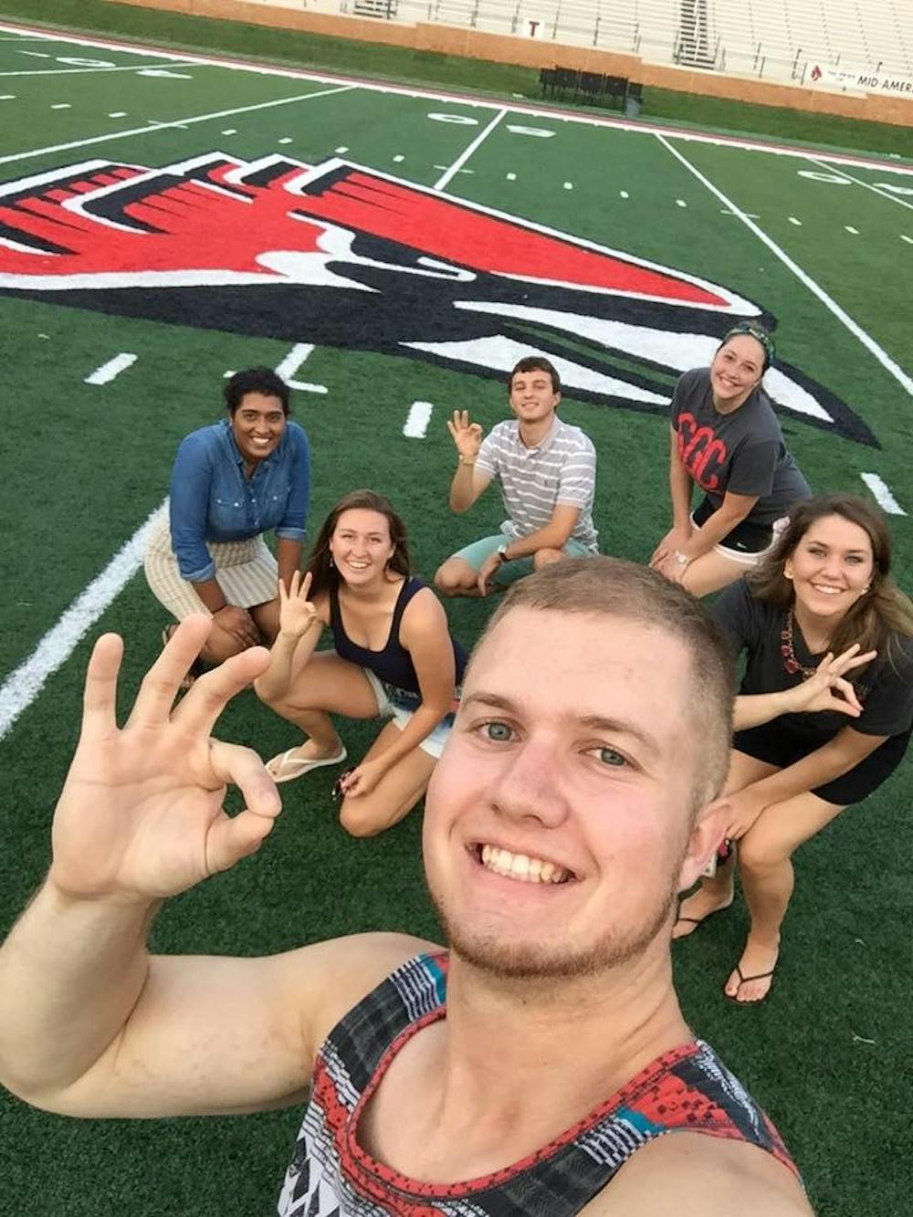 <p>Former SGA Vice President Bryan Kubel and others pose for a photo on Sept. 1 at Scheumann Stadium. The group went out to practice for the Cardinal Project, which is taking place after the football game on Sept. 3 at Scheumann Stadium. <em>PHOTO COURTESY OF FACEBOOK</em></p>