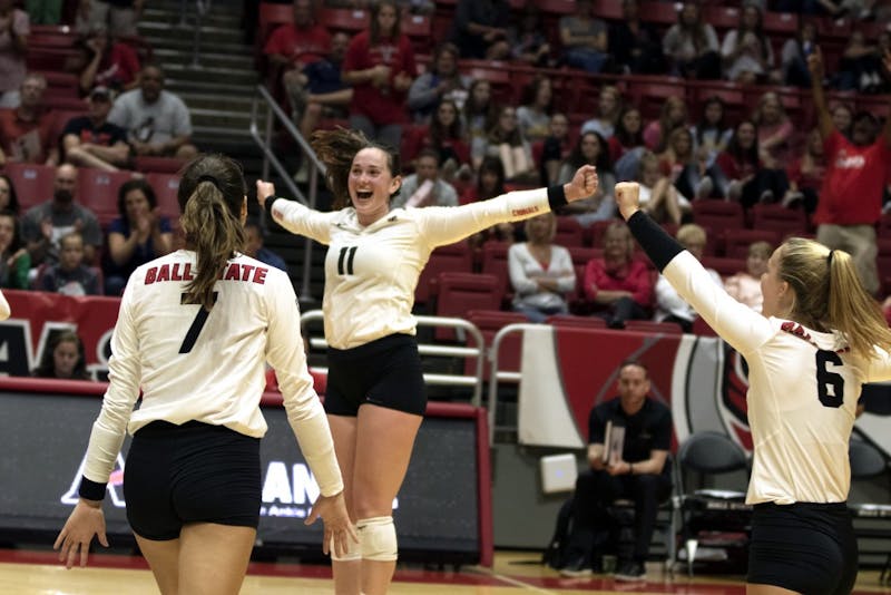 Natalie Risi (7), Amber Seaman (11), and Maggie Huber (6) &nbsp;celebrate winning their second match against Austin Peay on September 20, 2019, at Worthen Arena. Ball State continued on to win 3-0. Jaden Whiteman, DN