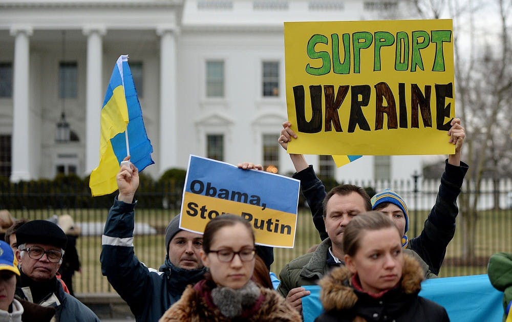 Protesters gather outside the White House to call on the U.S. and European Union to do more to combat Russian aggression in Ukraine's Crimea on Saturday, March 1, 2014, in Washington, D.C. (Olivier Douliery/Abaca Press/MCT)