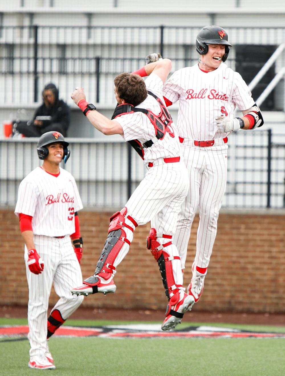 <p>First baseman Blake Bevis celebrates after hitting a home run against Southern Indiana March 26 at First Merchants Ballpark Complex. Andrew Berger, DN</p>