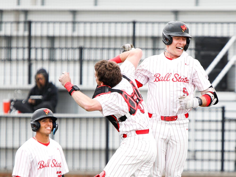 First baseman Blake Bevis celebrates after hitting a home run against Southern Indiana March 26 at First Merchants Ballpark Complex. Andrew Berger, DN