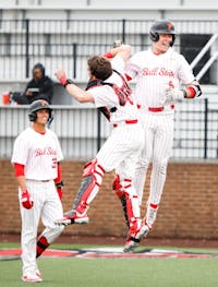 First baseman Blake Bevis celebrates after hitting a home run against Southern Indiana March 26 at First Merchants Ballpark Complex. Andrew Berger, DN