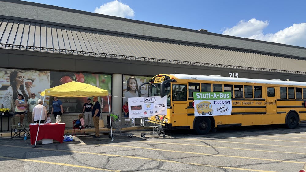 A tent and bus are set up at Payless in Muncie, Indiana, Sept. 17, 2022, for a Hunger Awareness food drive held by the Muncie Soup Kitchen, Panther Pantry and Cardinal Kitchen. The event was from 9 a.m. to 4 p.m. Kyle Smedley, DN