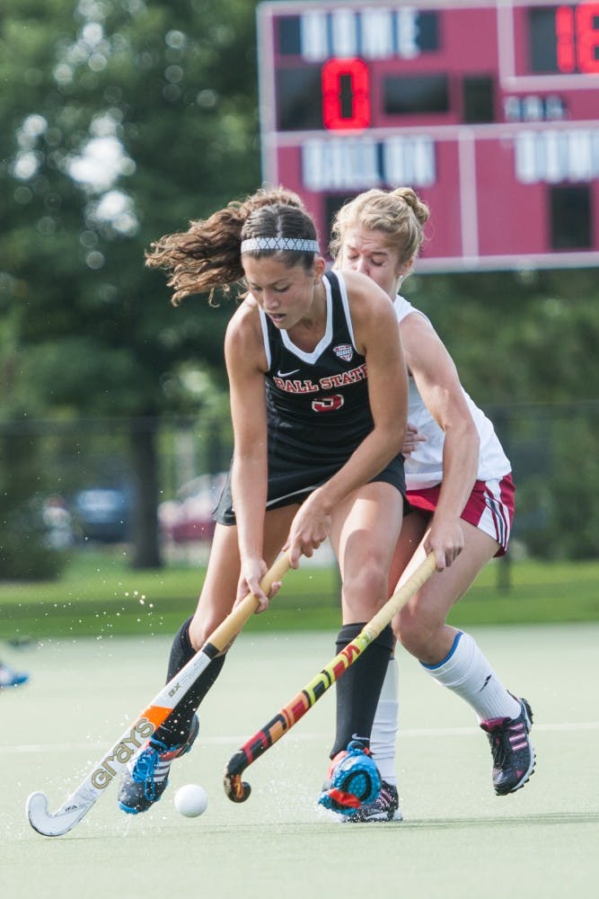 Junior midfielder Bethany Han contends with the Indiana University defense on Sept. 17 at the BSU Turf field. DN PHOTO JONATHAN MIKSANEK