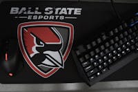 The mousepad with the Cardinal ESports logo sits on a desk March 29, 2021, in the ESports Arena. The new ESports team is a member of the ESports Collegiate Conference which includes all 12 Mid-American Conference schools and Northwestern. Jacob Musselman, DN
