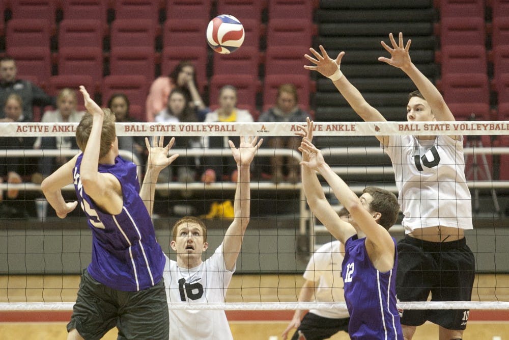 Senior Kevin Owens and sophomore Jack Lesure compete in the Midwest Intercollegiate Volleyball Association tournament last season. DN FILE PHOTO JORDAN HUFFER