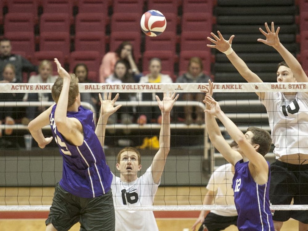 Senior Kevin Owens and sophomore Jack Lesure compete in the Midwest Intercollegiate Volleyball Association tournament last season. DN FILE PHOTO JORDAN HUFFER