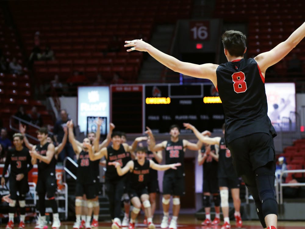 Second-year middle blocker Vanis Buckholz celebrates getting an ace in a game against BYU Feb. 4 at Worthen Arena. Buckholz had three aces during the game. Amber Pietz, DN