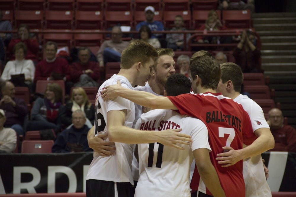 Players from the men's volleyball team celebrate after winning a point during the match against Sacred Heart. Ball State won the Jan. 11 match in three sets. DN PHOTO EMMA ROGERS