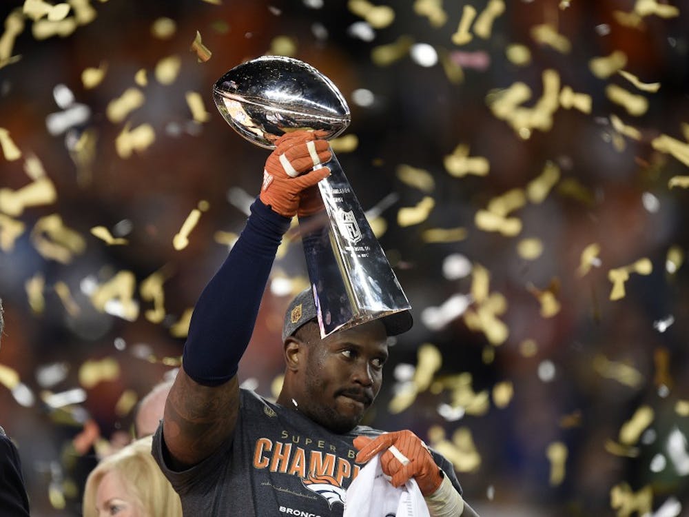 The game's Most Valuable Player, Denver Broncos linebacker Von Miller, celebrates as he holds the Vince Lombardi trophy after a 24-10 win against the Carolina Panthers in Super Bowl 50 at Levi's Stadium in Santa Clara, Calif., on Sunday, Feb. 7, 2016. (Jose Carlos Fajardo/Bay Area News Group/TNS)