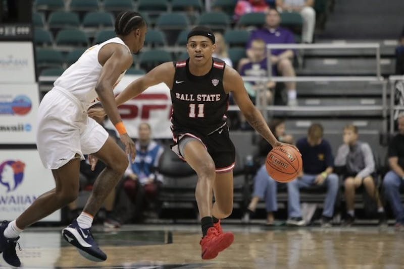 Redshirt freshman guard Jarron Coleman powers past a UTEP defender in a game against the Miners on Dec. 23 in Honolulu, Hawaii. The Cardinals lost to the Miners, 71-70. Ball State Athletics, photo provided&nbsp;