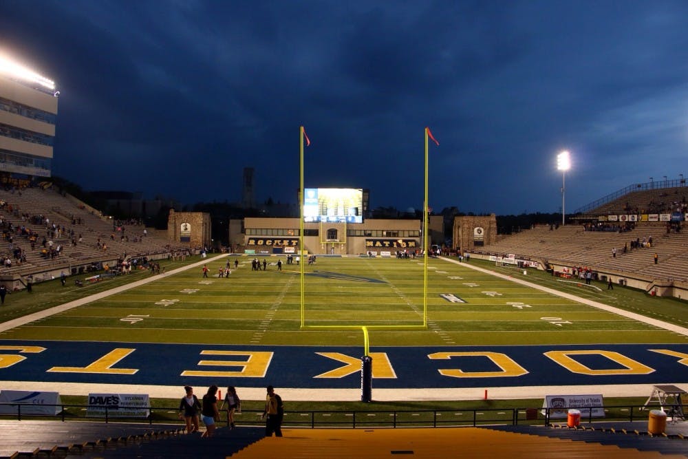 A storm approaches The Glass Bowl during the first quarter of the game on Sept. 20. Attendees and players were sent to shelter. DN PHOTO TAYLOR IRBY