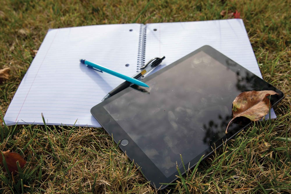 <p>Different studying materials lay on the grass Oct. 14, 2020, in Noblesville, Indiana. Tutors and Supplemental Instruction Leaders at the Learning Center offer tutoring and study sessions for students looking for help with &quot;historically difficult&quot; classes. <strong>Jacob Musselman, DN Illustration</strong></p>
