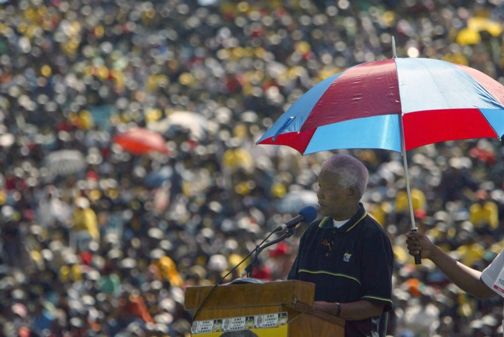 elson Mandela speaks to a cheering crowd at an African National Congress rally on April 4, 2004, in Soweto, South Africa. Mandela died on Thursday, Dec. 5, 2013. MCT PHOTO