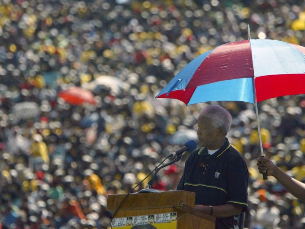 elson Mandela speaks to a cheering crowd at an African National Congress rally on April 4, 2004, in Soweto, South Africa. Mandela died on Thursday, Dec. 5, 2013. MCT PHOTO