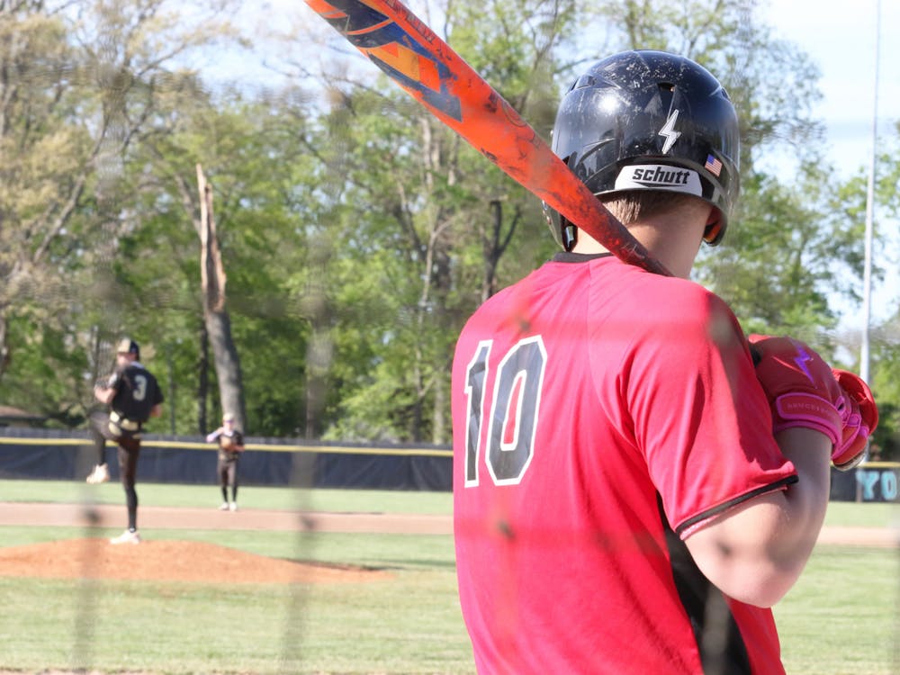 Wapahani senior Daxton Dudley watches Daleville starting pitcher junior Meryck Adams from the on-deck circle during first round of Delaware County Tournament at Yorktown High School. Zach Carter, DN