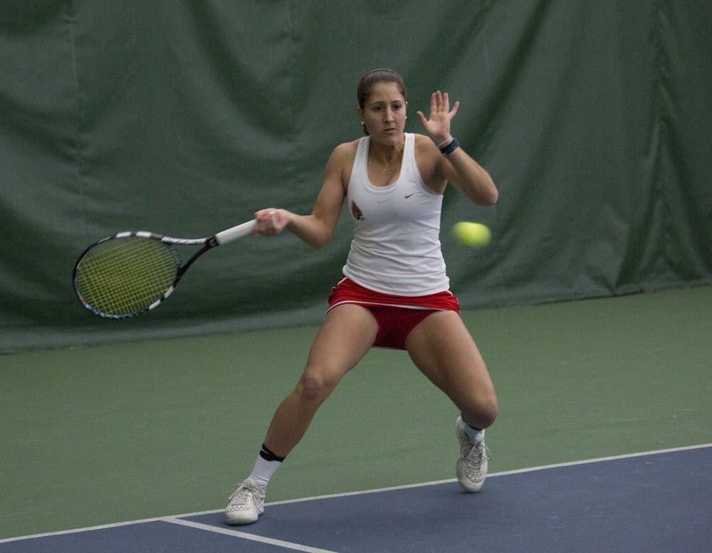 Senior Carmen Blanco hits a forehand during her singles match against Wright State on Feb. 5. Emma Rogers // DN