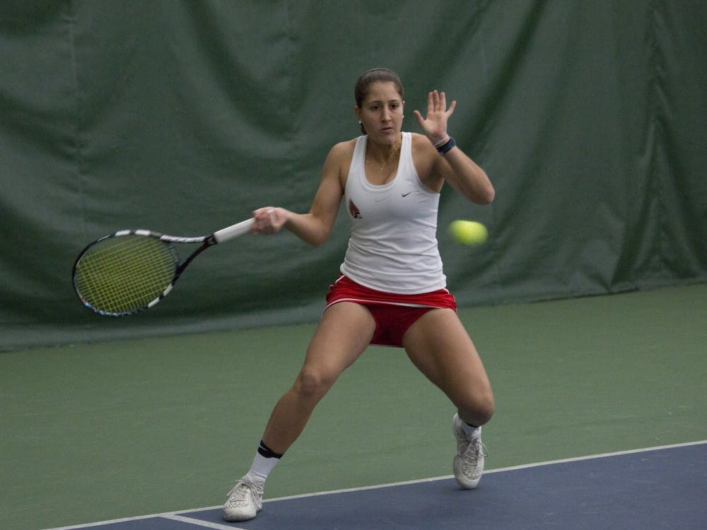 Senior Carmen Blanco hits a forehand during her singles match against Wright State on Feb. 5. Emma Rogers // DN
